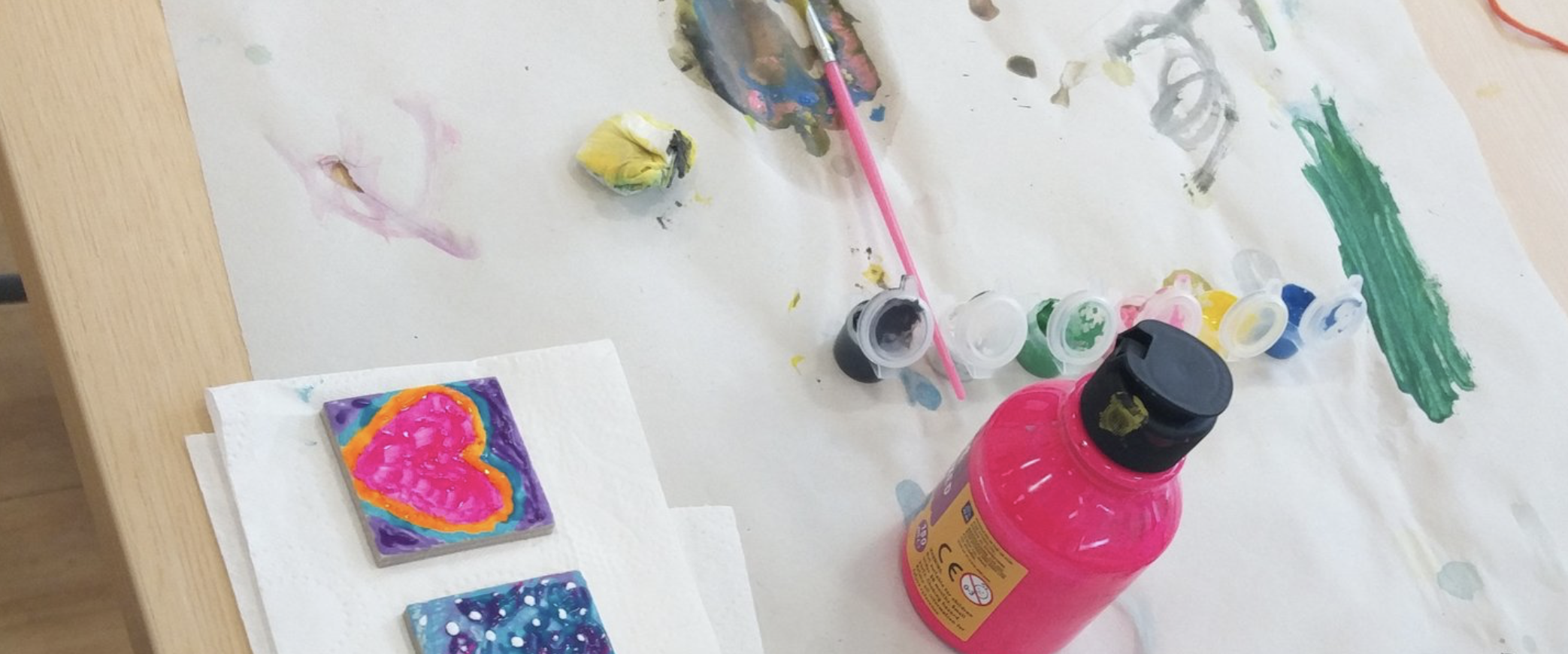 painting supplies on a table for painting tiles in fun colours