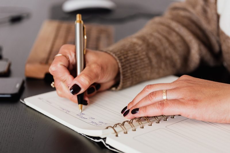 a woman making notes about something